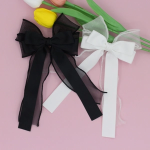 Barrettes à cheveux élégantes avec nœuds superposés en noir et blanc et longs rubans