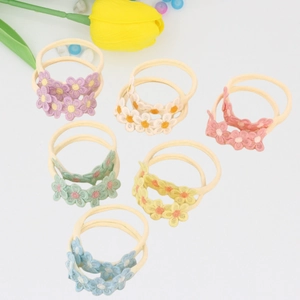 Detail of 6-piece baby flower headband set in pastel colors with lace embroidery