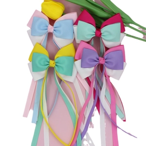 Set of colorful ribbed bow hair clips with long streamers for sweet girls hair styling