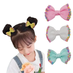 Kids ribbed bow hair clips with rainbow beads set and model wearing demonstration