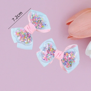 Pair of 7.2cm grosgrain bow hair clips with sequins and heart detail for girls
