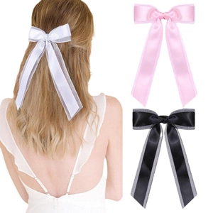 Double-layered bow hair clip with long ribbons in white, pink and black colors