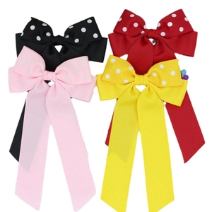 Fermagli per capelli con fiocco a pois e nastri lunghi nei colori nero, rosso e rosa