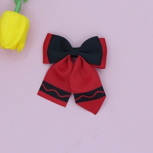 Detailed view of handmade grosgrain ribbon hair bow with school style back-to-school theme