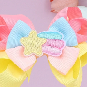 Colorful grosgrain ribbon bow hair clip with embroidered shooting star for children