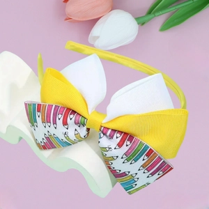 Kids yellow pencil print bow headband for back to school hair accessory on white stand