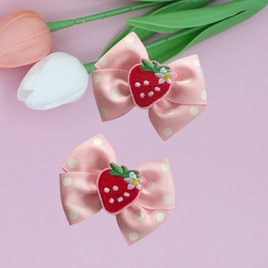 Set of two pink polka dot bow hair clips with cute strawberry embroidery for girls