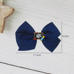 Nœud à cheveux bleu marine avec mini tableau noir et pomme pour la rentrée scolaire