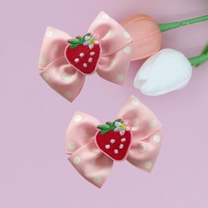 Pink polka dot bow hair clips for kids featuring cute strawberry embroidery accents