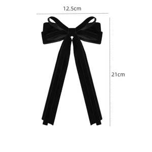Elegant black velvet bow hair clip with long ribbons and a vintage French style design