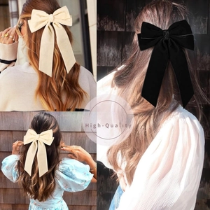 Velvet bow hair clips in beige and black with long ribbons for a sweet princess look