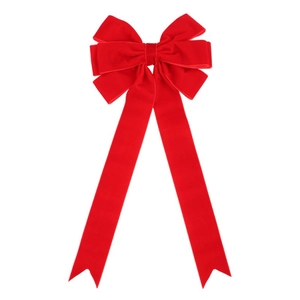 Detail of a large red velvet Christmas bow with long ribbons for tree and wreath decor