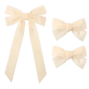 Detail view of 3-piece cream velvet bow set with long ribbon and premium stitching
