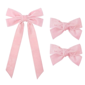 Three-piece set of pink velvet bow hair clips featuring long ribbons and a soft texture