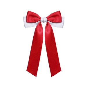 Detail of red and white double-layered satin ribbon bow hairpin with long flowing streamers