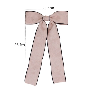 Pink bow hair clip with black piping and jacquard texture for an elegant French style