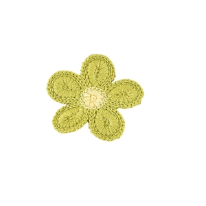 Detail showing handcrafted crochet flower hair clip with green petals and yellow center