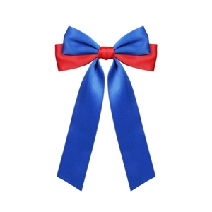 Close-up of red and blue satin ribbon bow hair clip with elegant long streamers