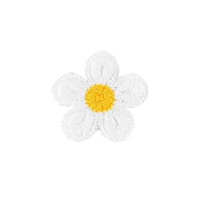 Close-up detail of white and yellow hand-crocheted daisy flower hair clip accessory