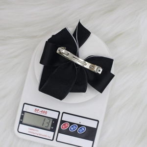 Elegant black bow hair clip with silver spring clip on scales, 13g lightweight design