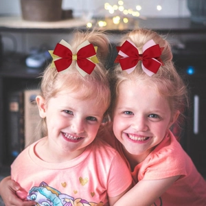 Fermagli per capelli con fiocchi di paillettes per bambine in rosso, oro e rosa