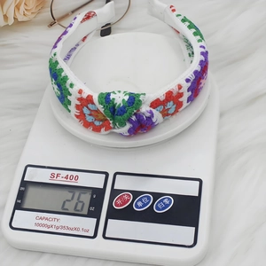 Bohemian colorful crochet knit headband on a scale weighing 26g for women accessory