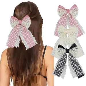 Elegant large lace layered bow hair clip with long tassels in pink, cream, and black