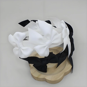 Elegant layered bow headband in black and white styles for a sweet princess look
