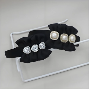 Elegant black satin pleated headband with heart crystals and faux pearls decor