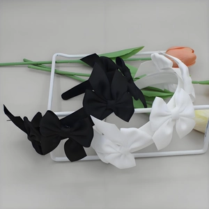 Elegant satin bow headband set in black and white colors with a French style