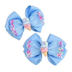 Paire de barrettes à cheveux nœuds bleus avec décor crème glacée et paillettes colorées