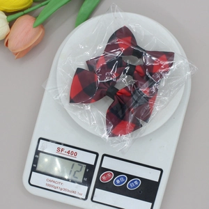 Paire de barrettes à nœud en ruban gros-grain à carreaux rouges et noirs pour filles