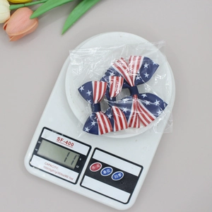 Paire de barrettes à cheveux avec nœuds drapeau américain pour filles en rouge blanc et bleu