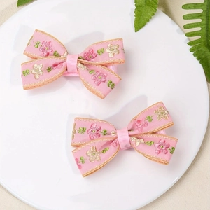 Fermagli per capelli etnici con fiocchi rosa e ricami floreali per bambine