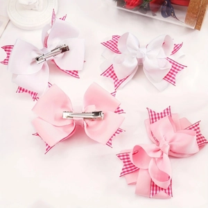 Set mit vier handgefertigten Haarspangen mit rosa und karierten Schleifen für Mädchen
