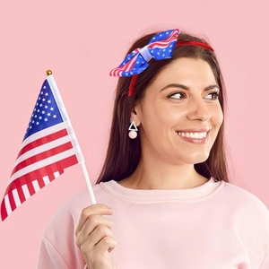Independence Day headband with stars and stripes bow on a model for festive hair decor
