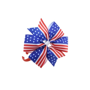 Detail of US Independence Day headband with red stripes and blue star ribbon patterns