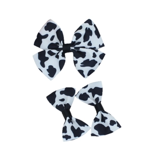 Cow print grosgrain ribbon bow hair clip set with large and small hair accessories