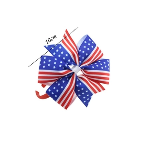 Detail view of a 10cm US flag bow headband with classic red stripes and blue star patterns