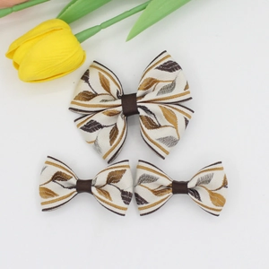 Three-piece jacquard floral bow hair clips set featuring elegant brown leaf patterns