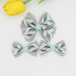 Floral embroidery bow hair clip set with large and small green leaf patterns