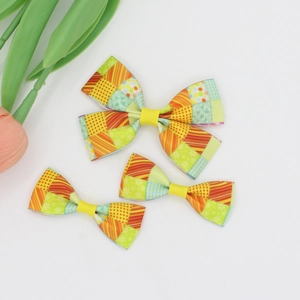 Rainbow striped grosgrain ribbon hair bow clips set on white background