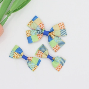 Three-piece set of colorful grosgrain ribbon hair bows with polka dots and stripes