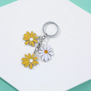 Daisy flower keychain with yellow and white pendants on a silver ring for women's bags