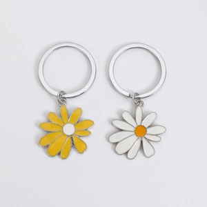 Daisy flower keychains with white and yellow enamel petals on metal split rings