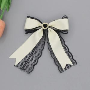 French style cream lace bow hair clip with black heart gemstone and rhinestone detail
