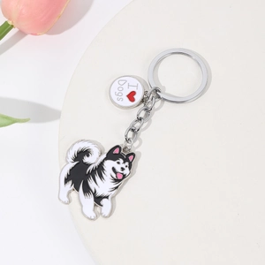 Cartoon dog alloy keychain with husky design and heart tag on a white tray