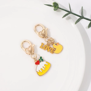 Cute golden cartoon duck and LOVE pendant keychains with heart-shaped lobster clasps