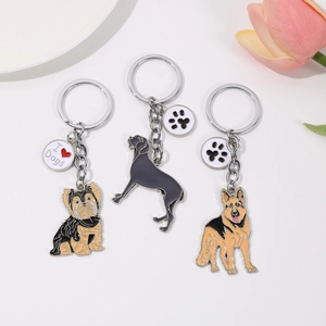 Tre portachiavi in metallo premium con motivi di Yorkshire Terrier e Pastore Tedesco