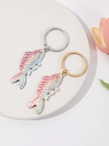 Detail of gradient enamel koi fish keychain with sparkling crystal eyes and metal rings